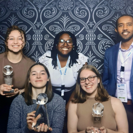 RPI students and mentor with awards won at conference